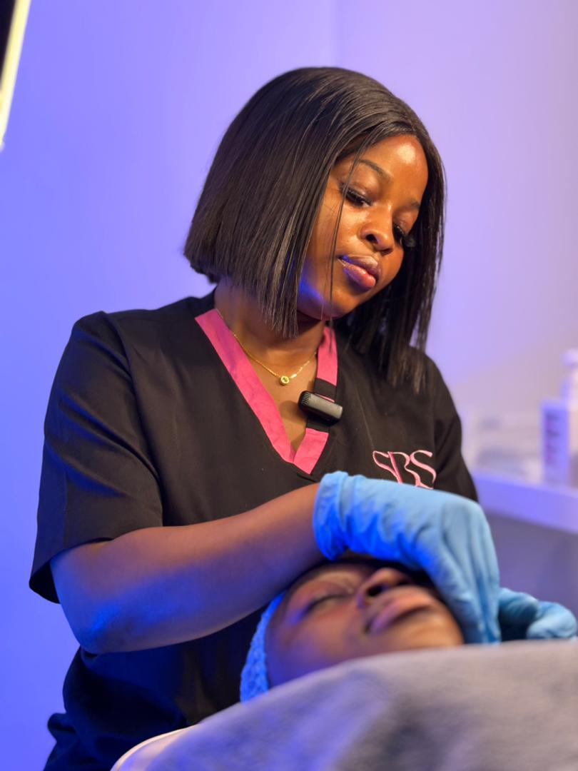 Skincare specialist performing a medical-grade facial treatment at Shortcaike Beauty Stores
